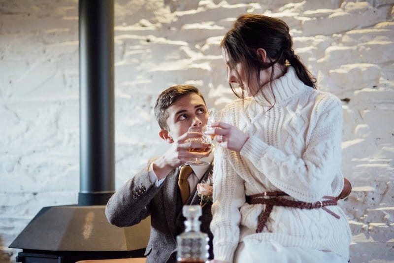 Bride and groom drinking brandy