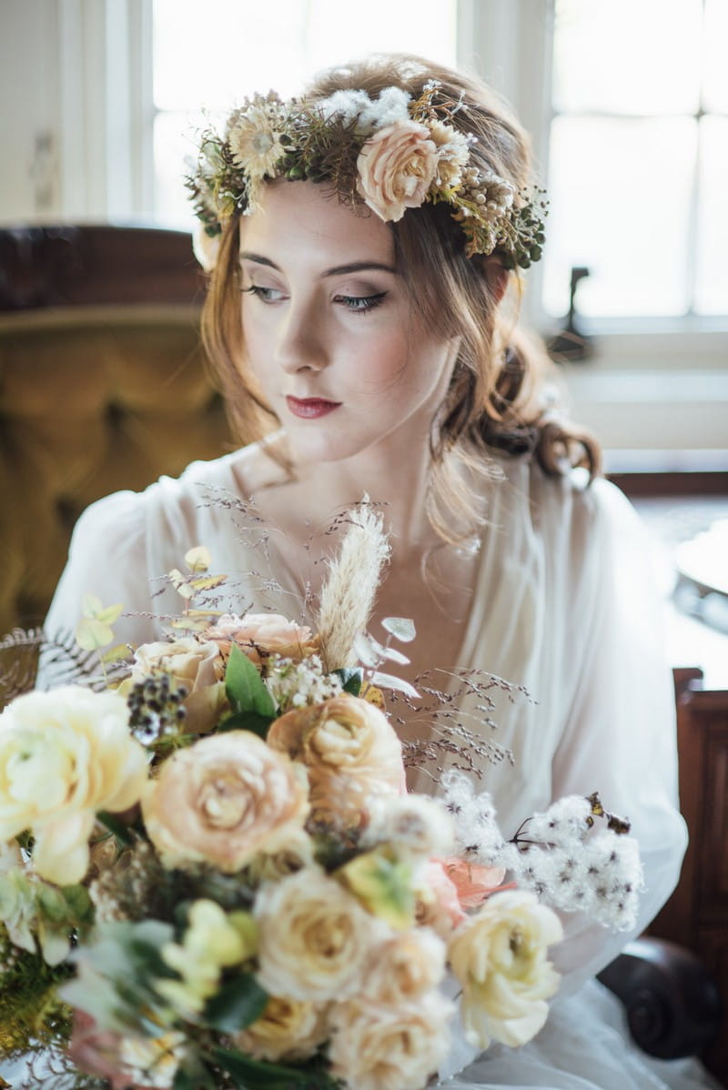 Bride wearing flower crown holding bouquet