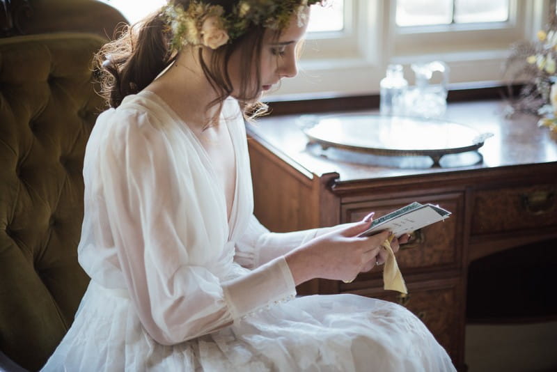 Bride reading wedding day love letter