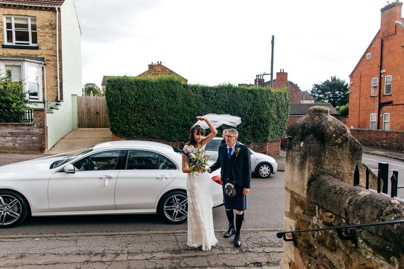 Father walking bride into church