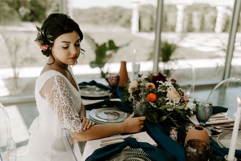 Bride sitting at wedding table