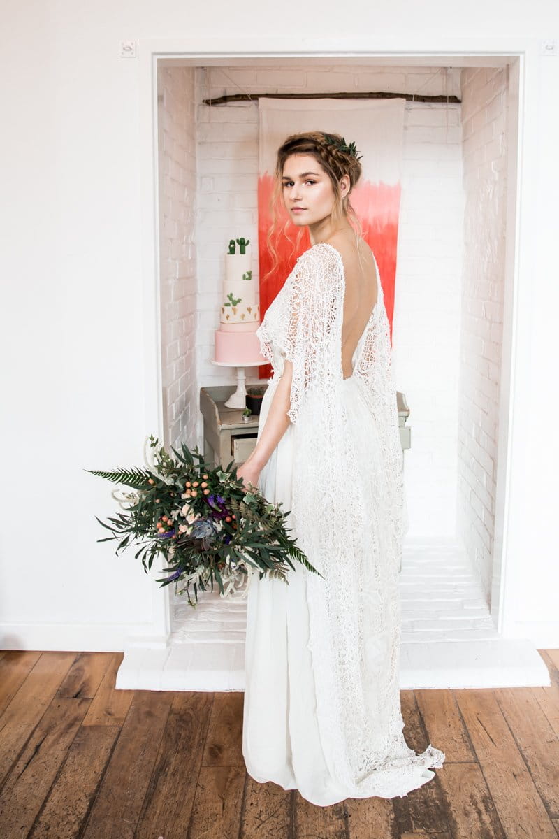 Bride wearing long open back wedding dress