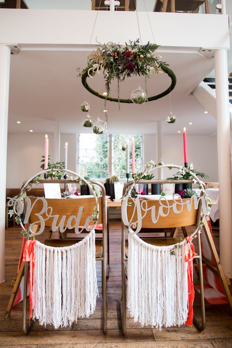 Wedding table with dreamcatcher-inspired backed wedding chairs