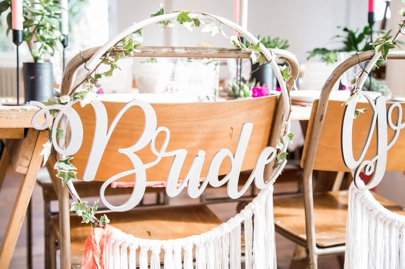 Bride dreamcatcher style hoop on back of wedding chair