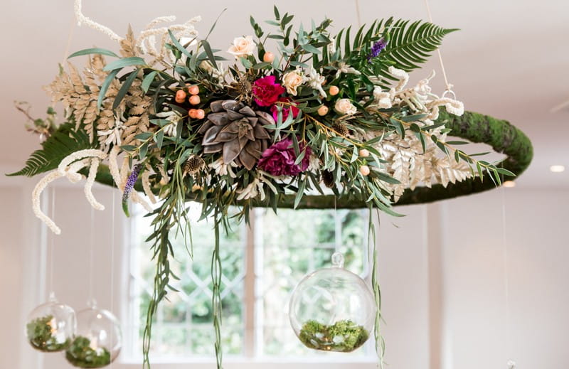 Foliage hoop hanging above wedding table