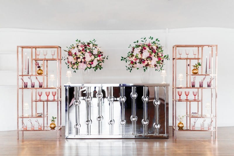 Engagement party bar with rose gold shelving