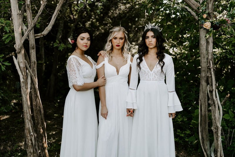 Three brides in white dresses