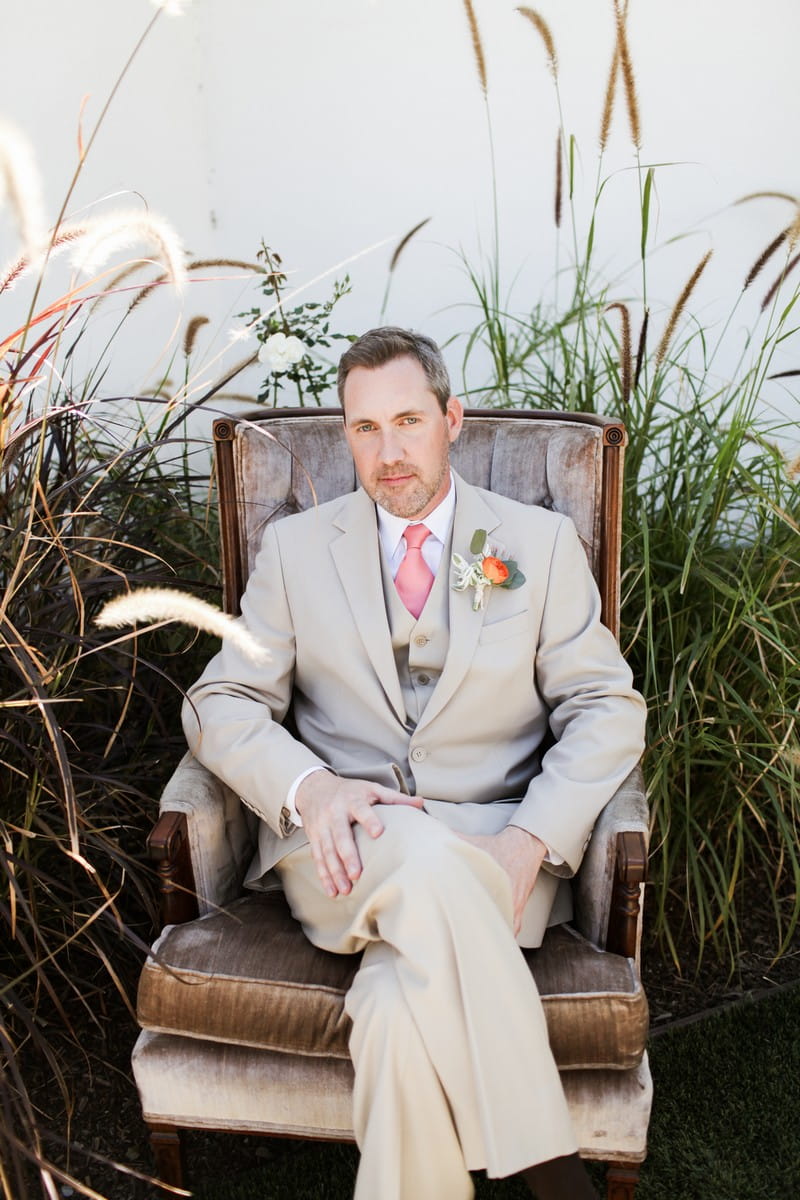 Groom sitting in chair