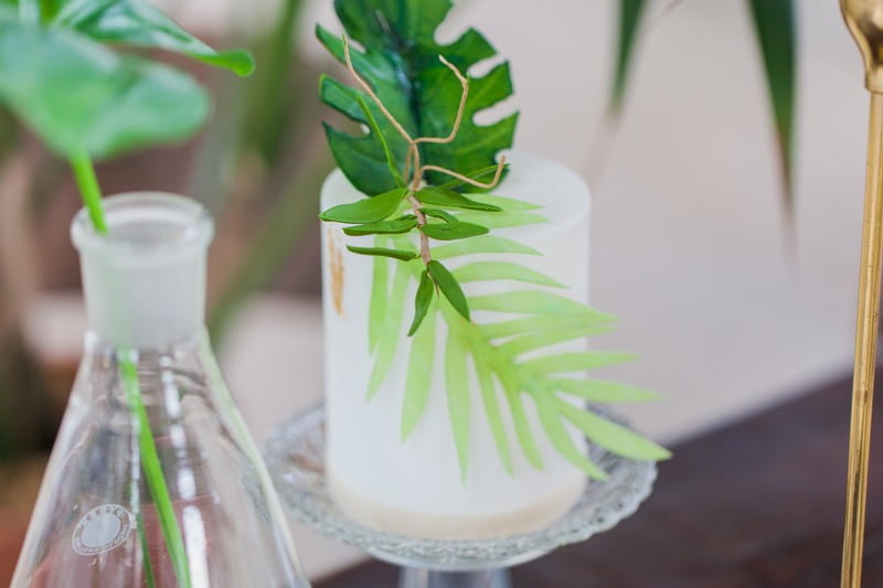 Palm leaf on small white wedding cake