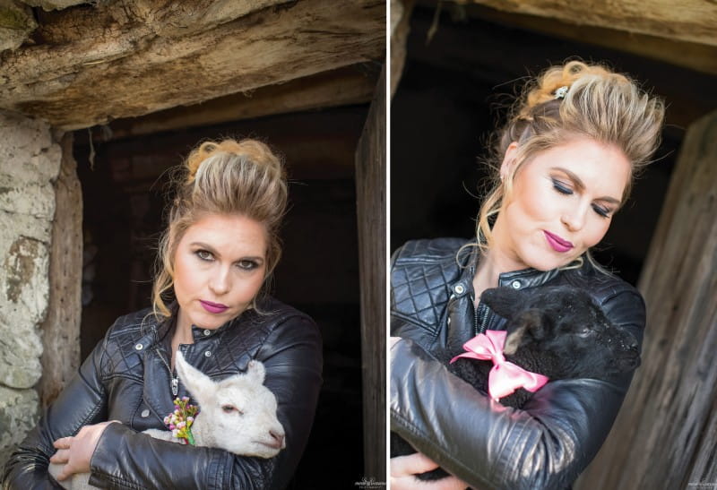 Bride in leather jacket holding baby goat