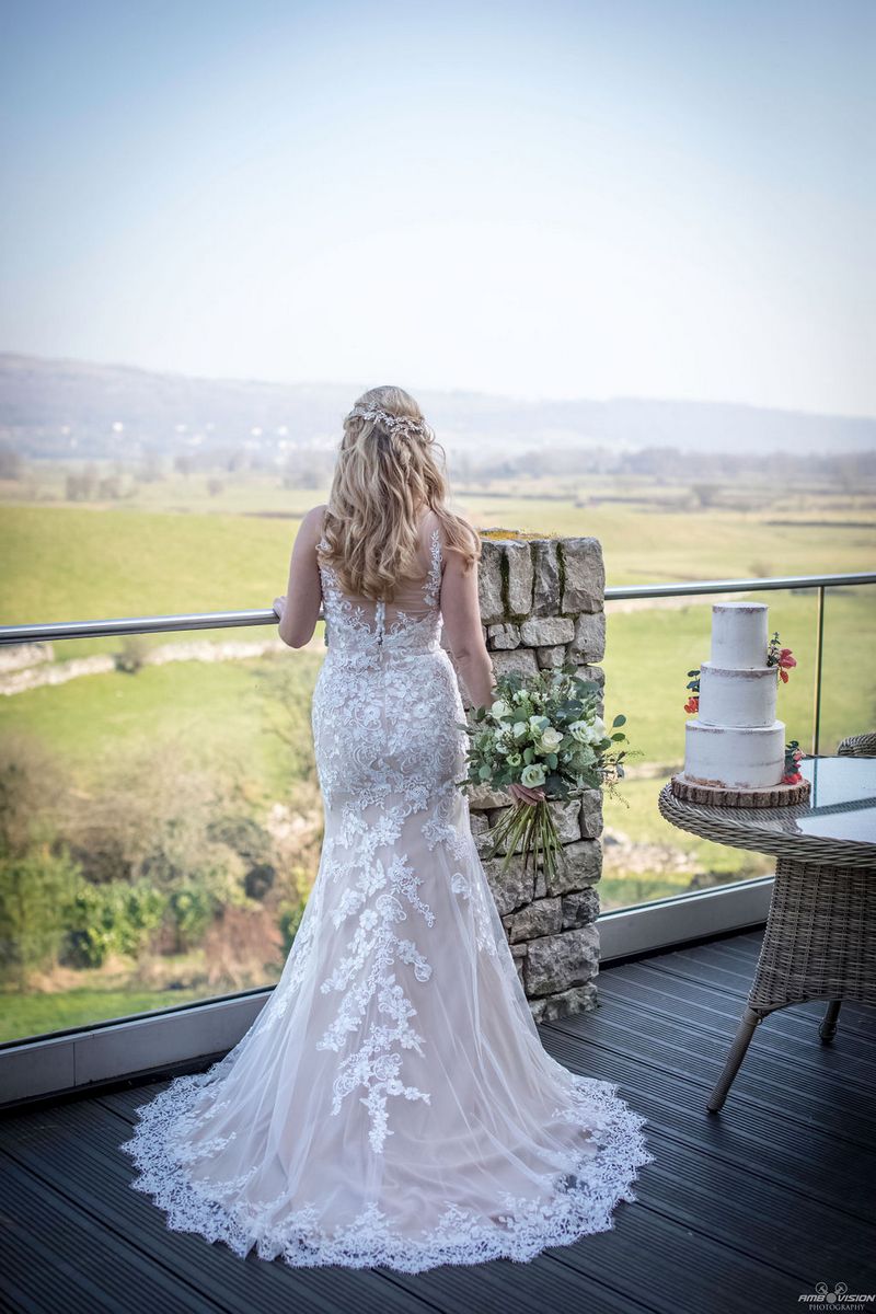 Bride looking out at countryside from Lyth Valley Country Inn