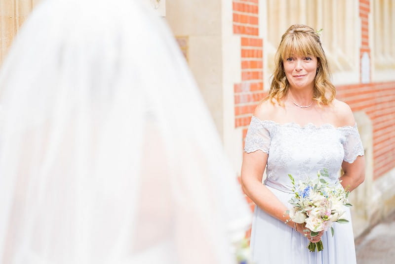 Bridesmaid emotional at seeing bride in wedding dress