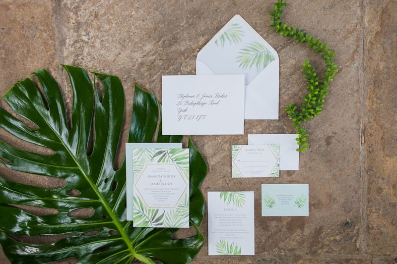 Wedding stationery with tropical palm leaf design