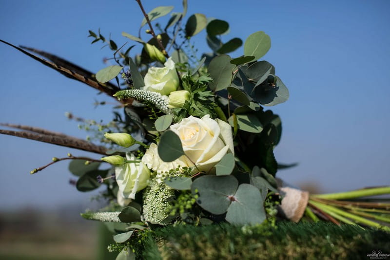 Wedding bouquet with white flowers and green foliage
