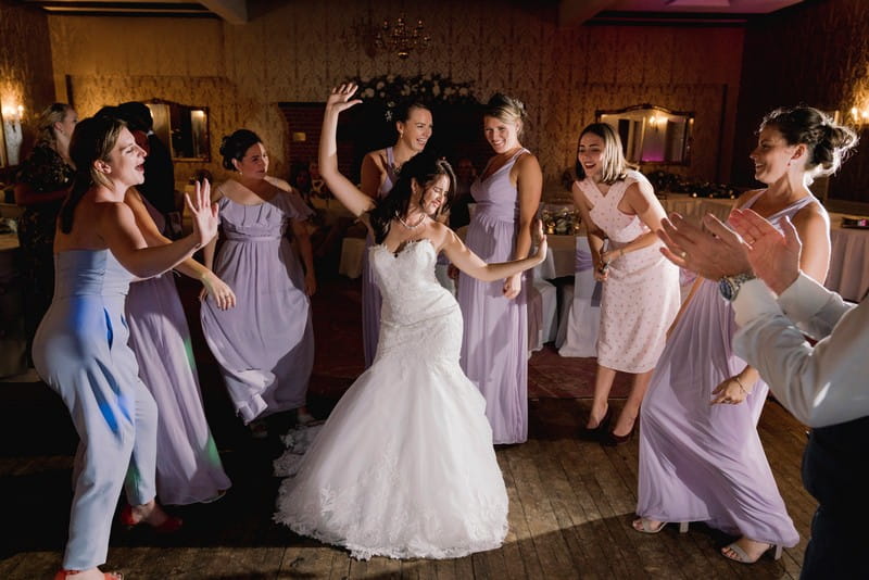 Bride and bridesmaids dancing at wedding - Picture by Murray Clarke