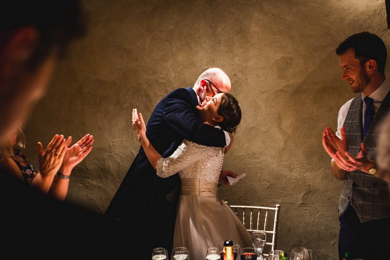 Father hugging bride after speech - Picture by How Photography