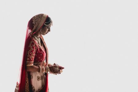 Indian bride holding decorated coconut - Picture by That Moment Photo