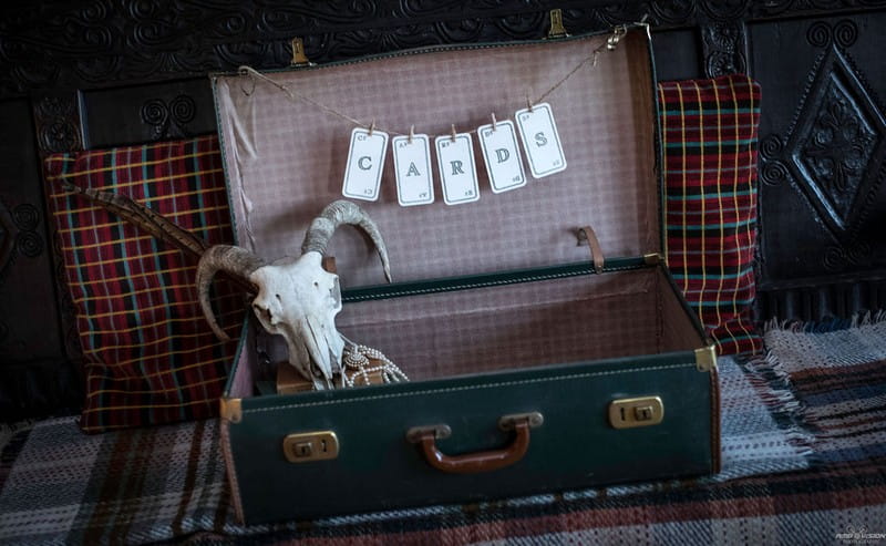 Old suitcase for wedding cards with animal skull