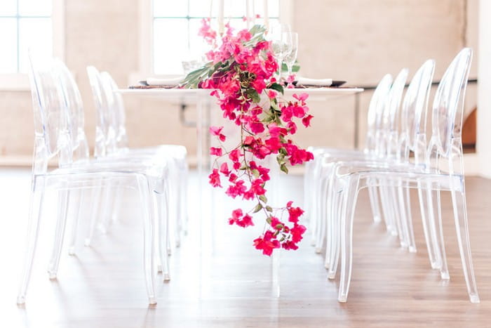 Bougainvillea hanging off of edge of wedding table