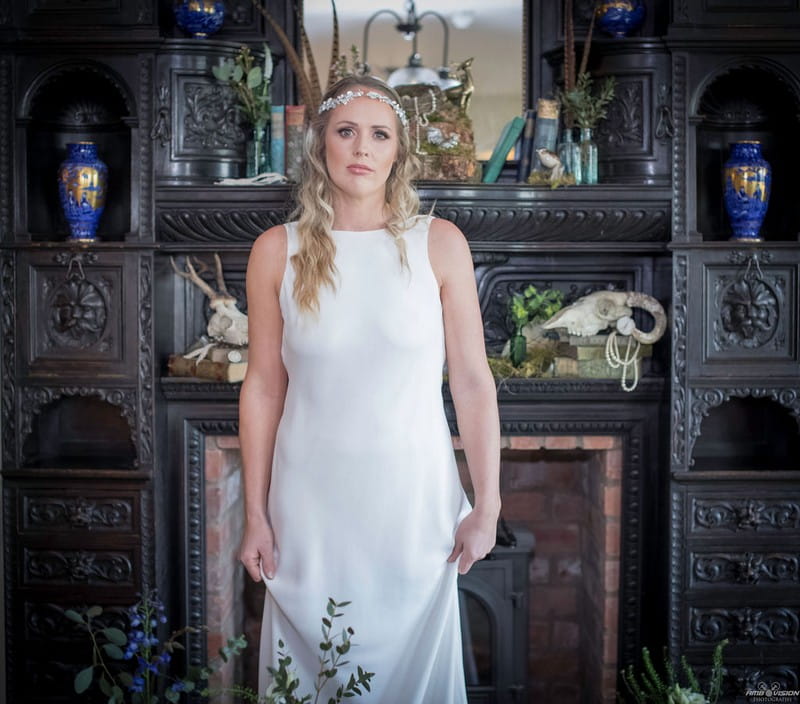 Bride standing in front of fireplace at Lyth Valley Country Inn