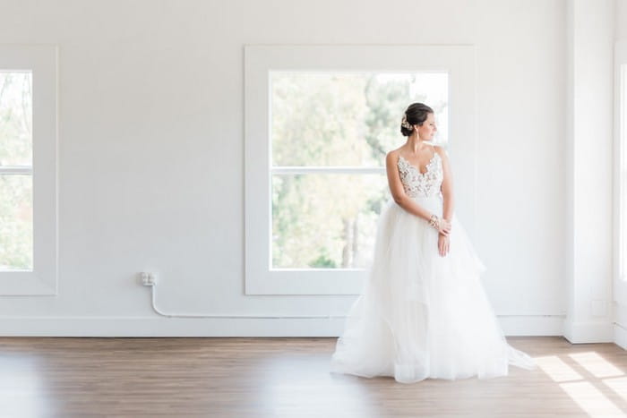 Bride standing in empty room