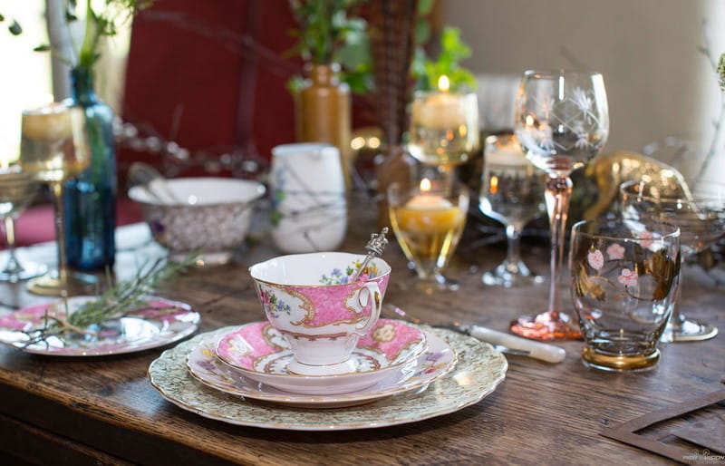 Pink china cup and saucer on rustic wedding table