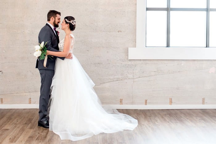 Bride and groom in warehouse venue