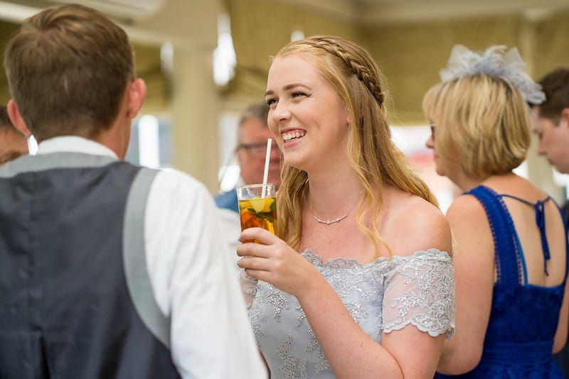 Bridesmaid with glass of Pimm's