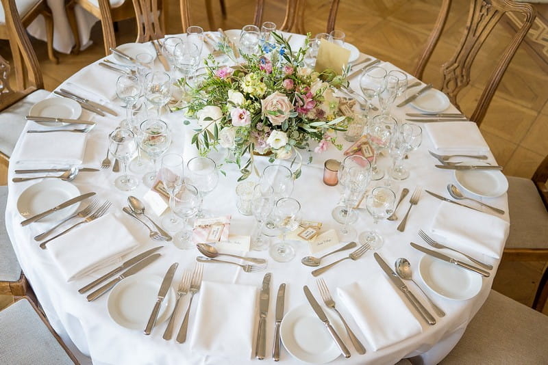 Round wedding table with garden flower centrepiece