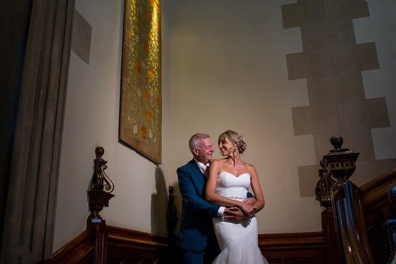 Bride and groom on stairs at Pendley Manor