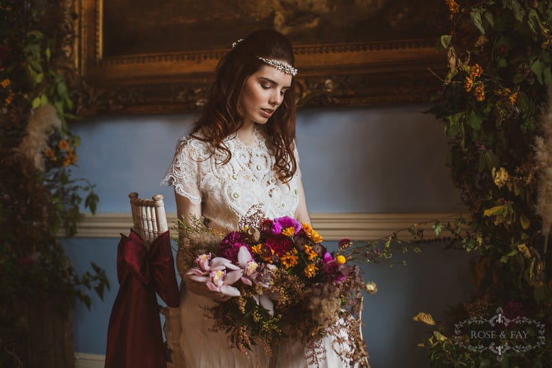 Bride sitting in chair holding bouquet