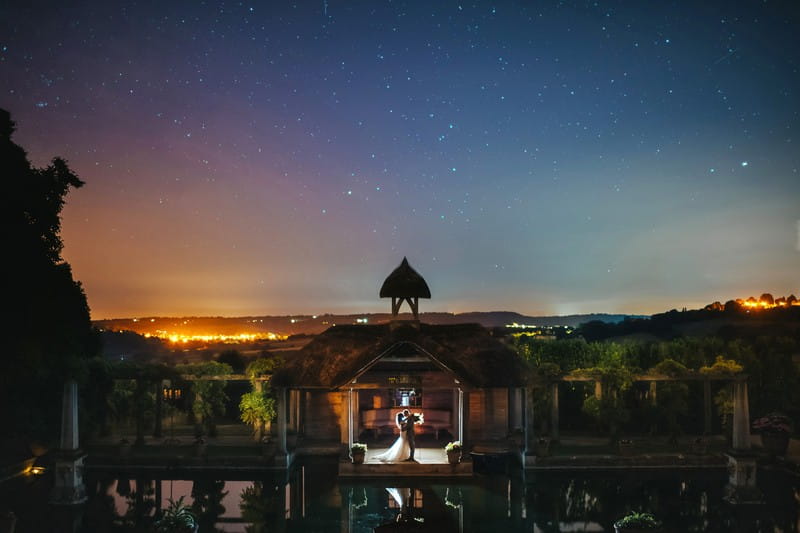 Bride and groom by pool at Euridge Manor under starry sky - Picture by Joab Smith