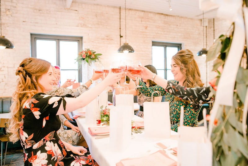 Girls toasting with glasses at bridal shower