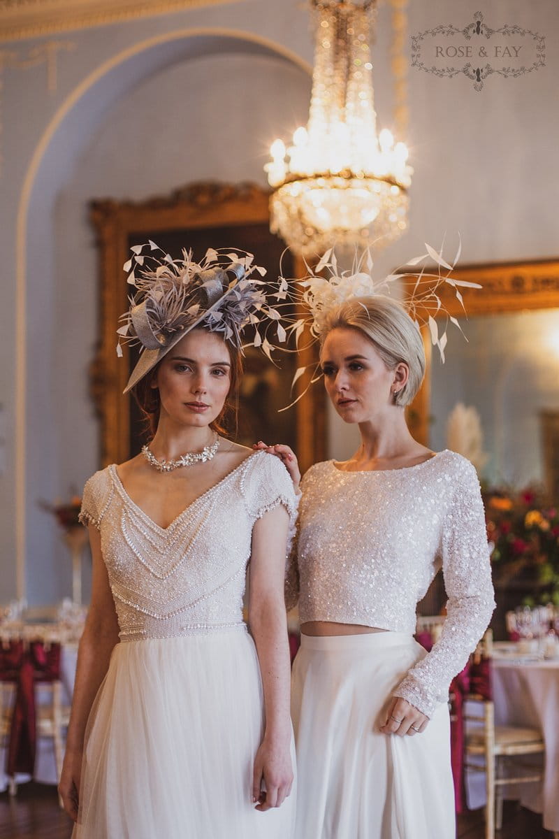 Two brides wearing hats