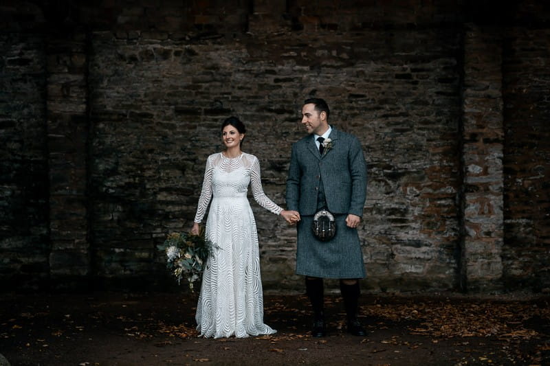 Bride with groom in Scottish wedding attire