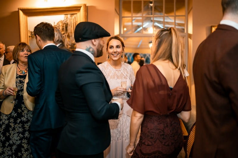 Wedding guests talking during welcome drinks