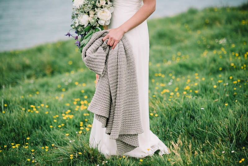 Bride holding grey shawl