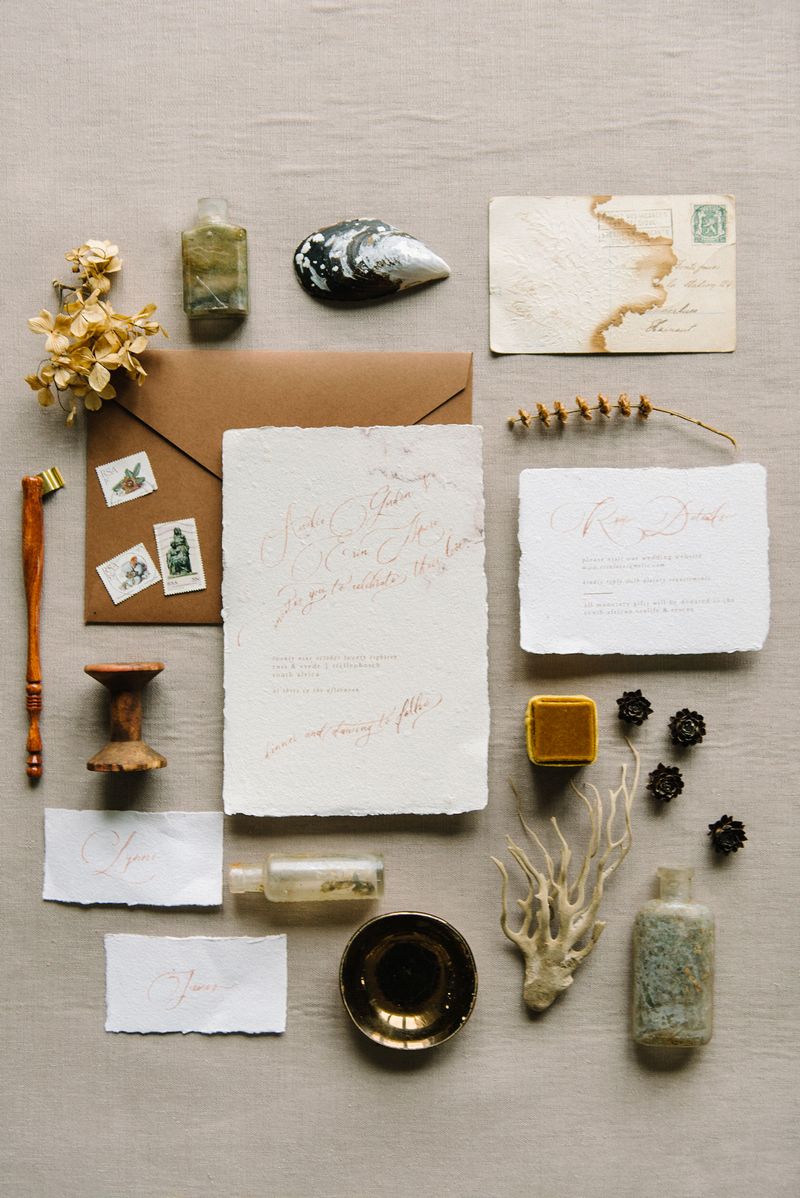 Rustic style wedding stationery with beach related items