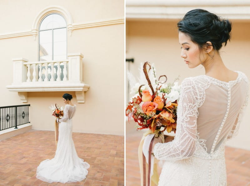 Elegant bride holding autumnal bouquet