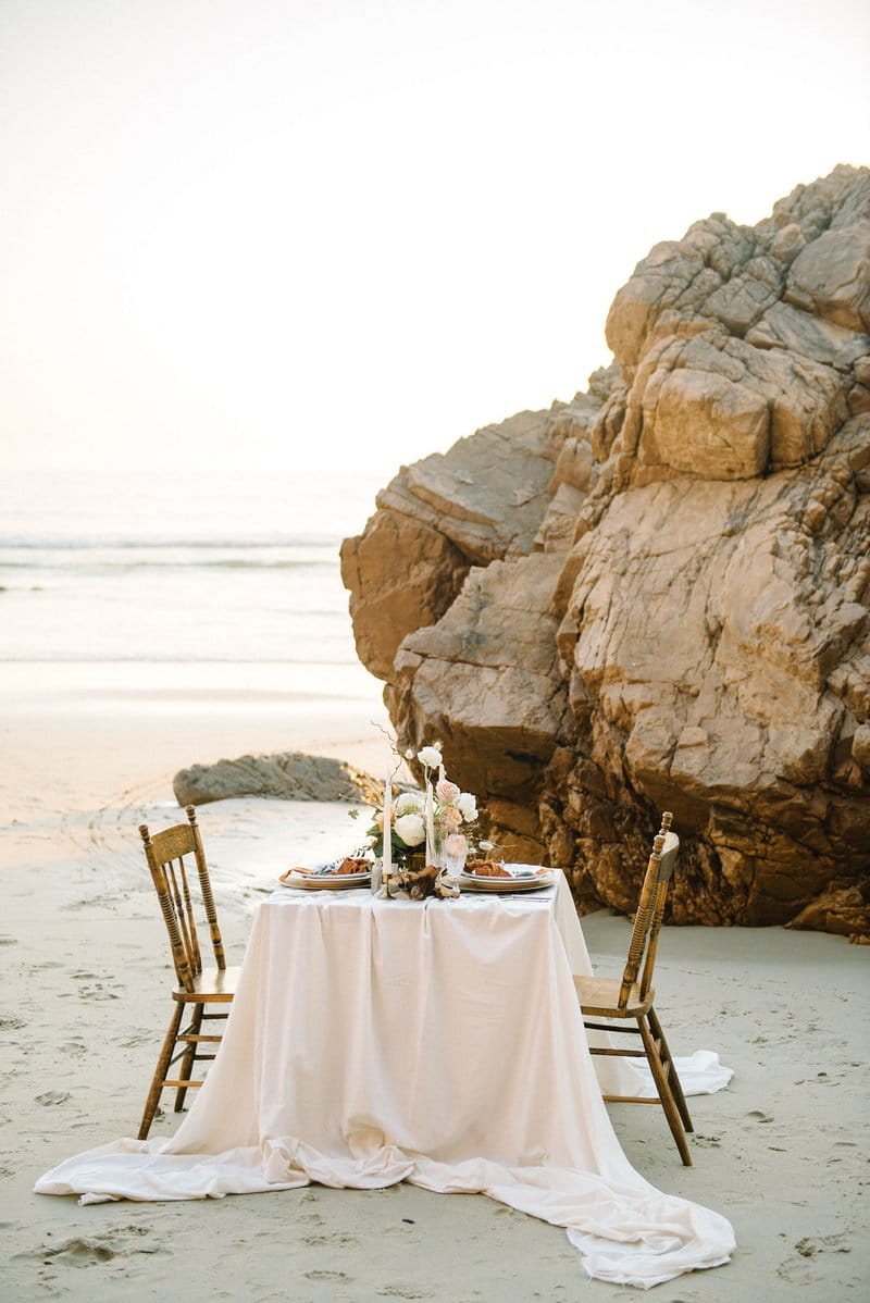 Small wedding table on beach by the sea