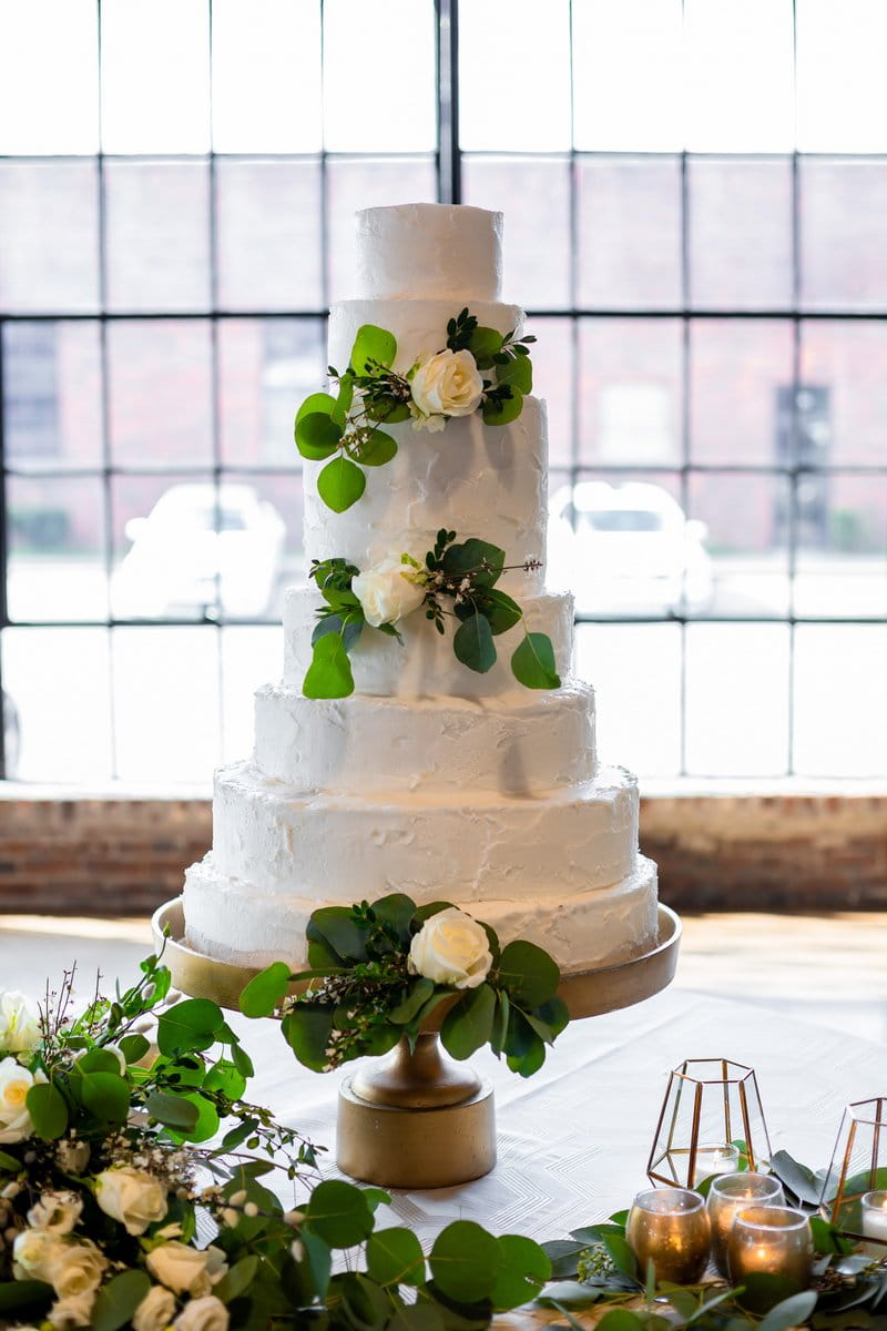 Wedding cake decorated with foliage