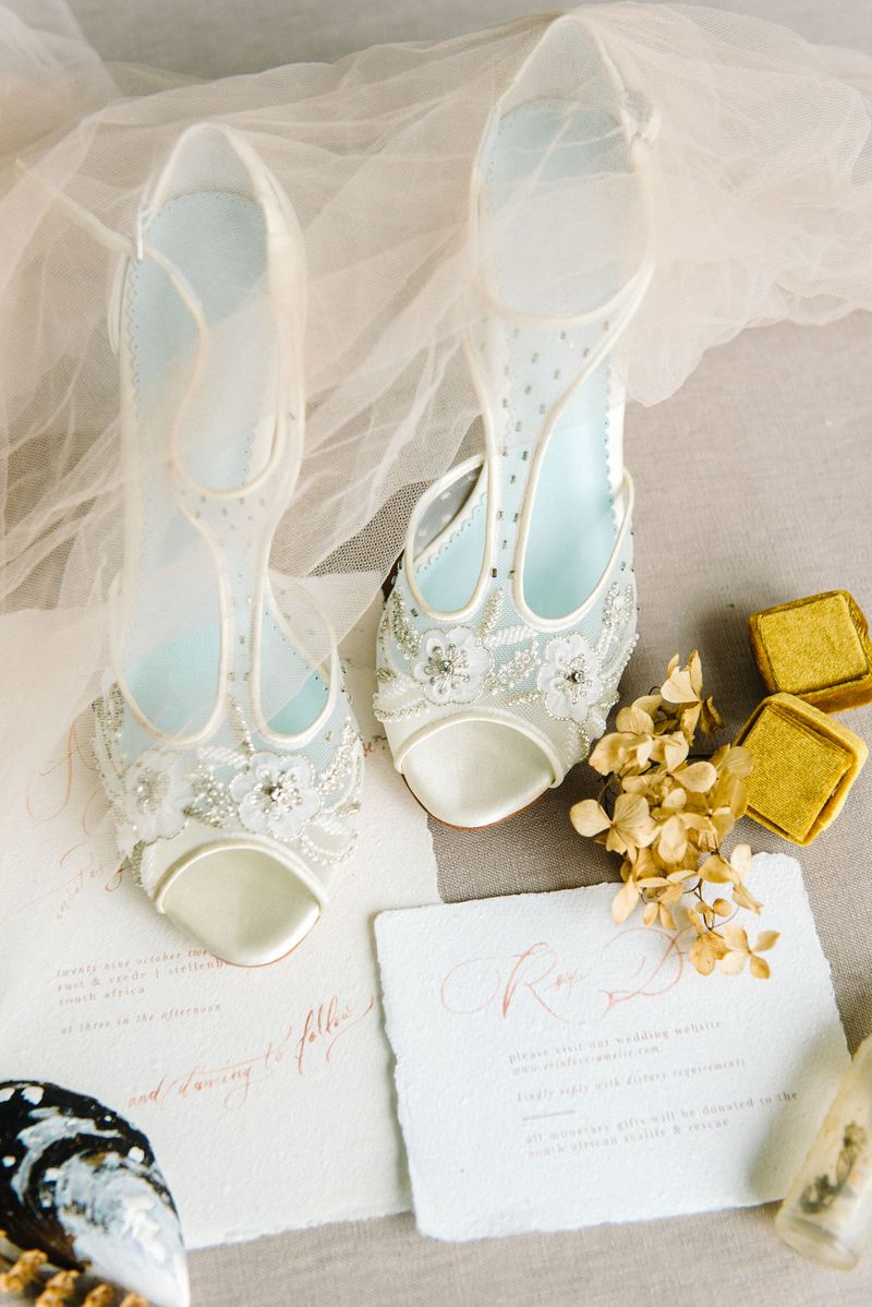 Bridal shoes with rustic wedding stationery