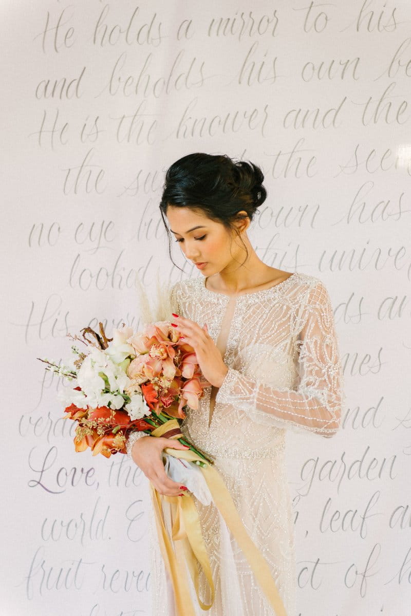 Bride holding autumnal bouquet