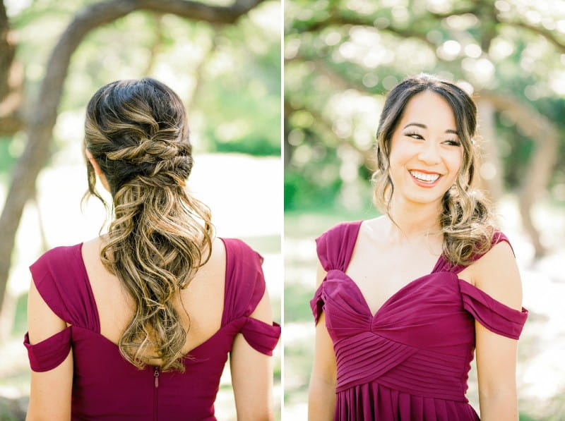Bridesmaid with messy braid hairstyle wearing maroon dress