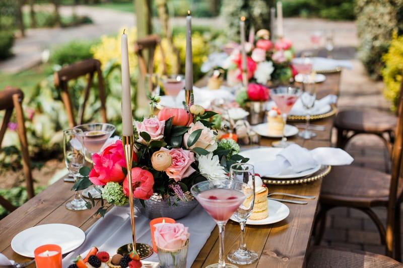 Wedding table styling with flowers and gold candlesticks
