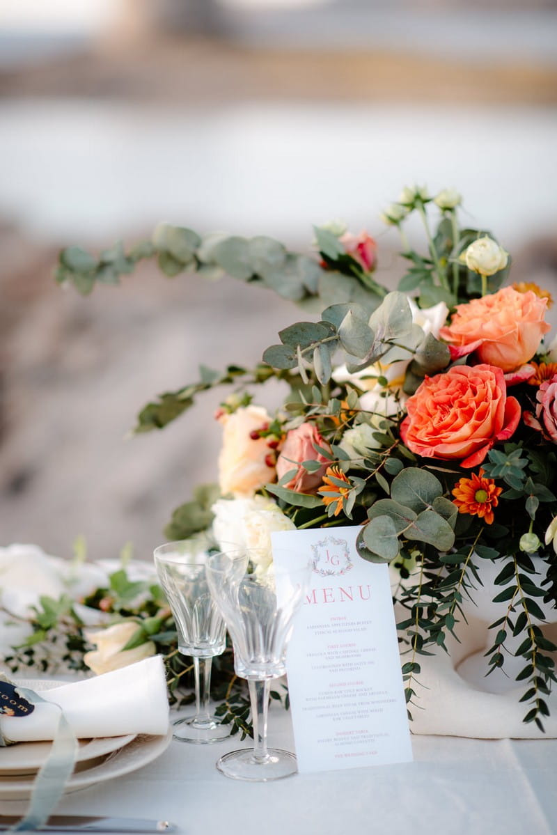 Flowers and menu on small wedding table