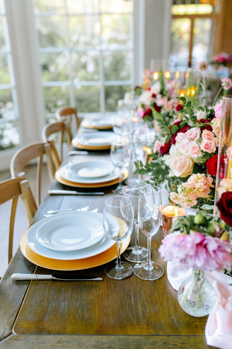 Rows of wedding plates on yellow chargers