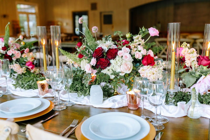 Burgundy and pink wedding table flowers
