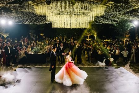 Bride and groom on dance flor under elaborate ceiling display - Picture by Kristian Leven Photography