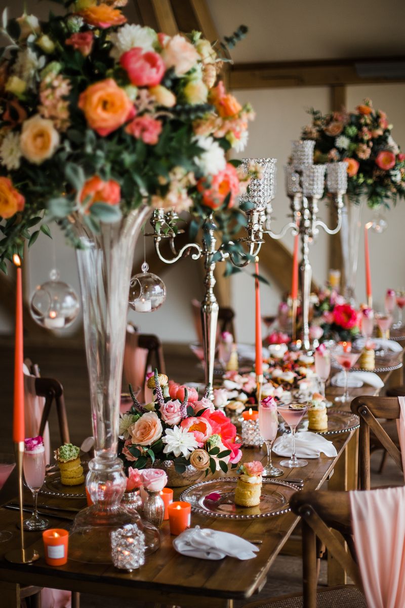 Wedding table with tall flower displays and candelabra